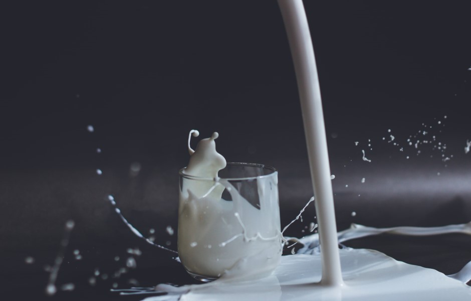 milk splashing out of glass
